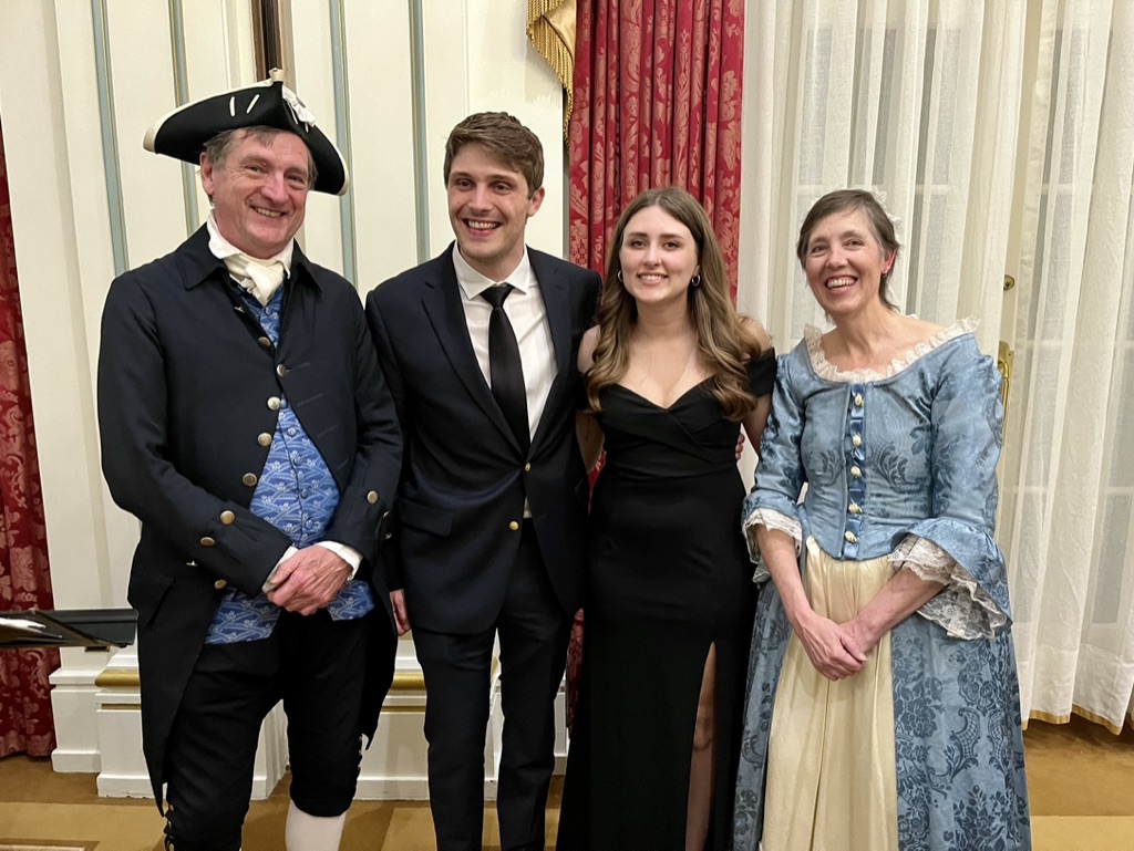 Kai Werner, M.A. '21, Ph.D. '26, past OFFV scholarship recipient (second from left), and guest, with David and Ginger Hildebrand, directors of the Colonial Music Institute at George Washington's Mount Vernon, at the OFFV annual banquet.