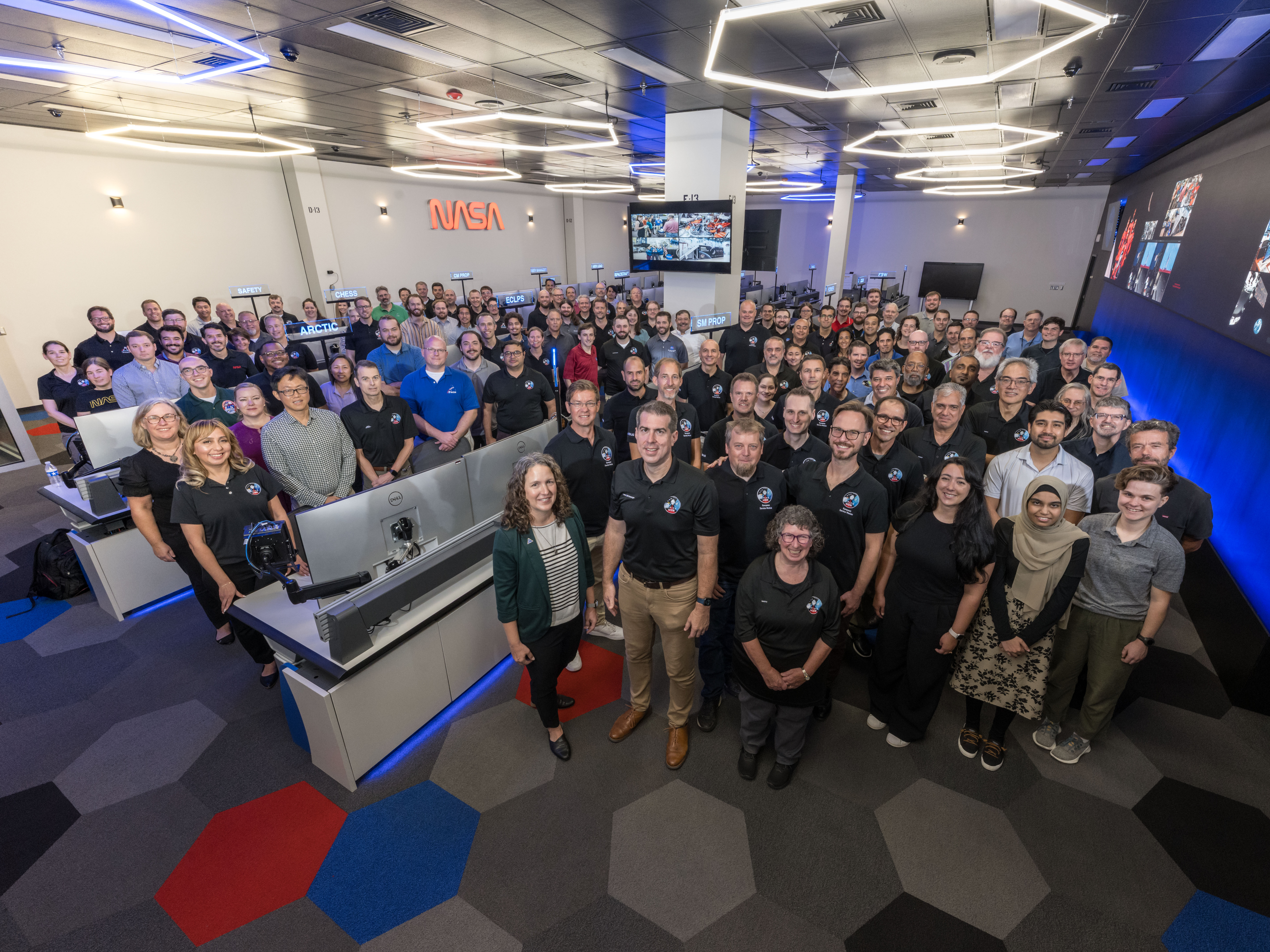 Elisa Leal Acevedo (pictured third from right in the front row) in the NASA Mission Evaluation Room in Houston during the Artemis II mission. Photo by Josh Valcarcel, NASA.