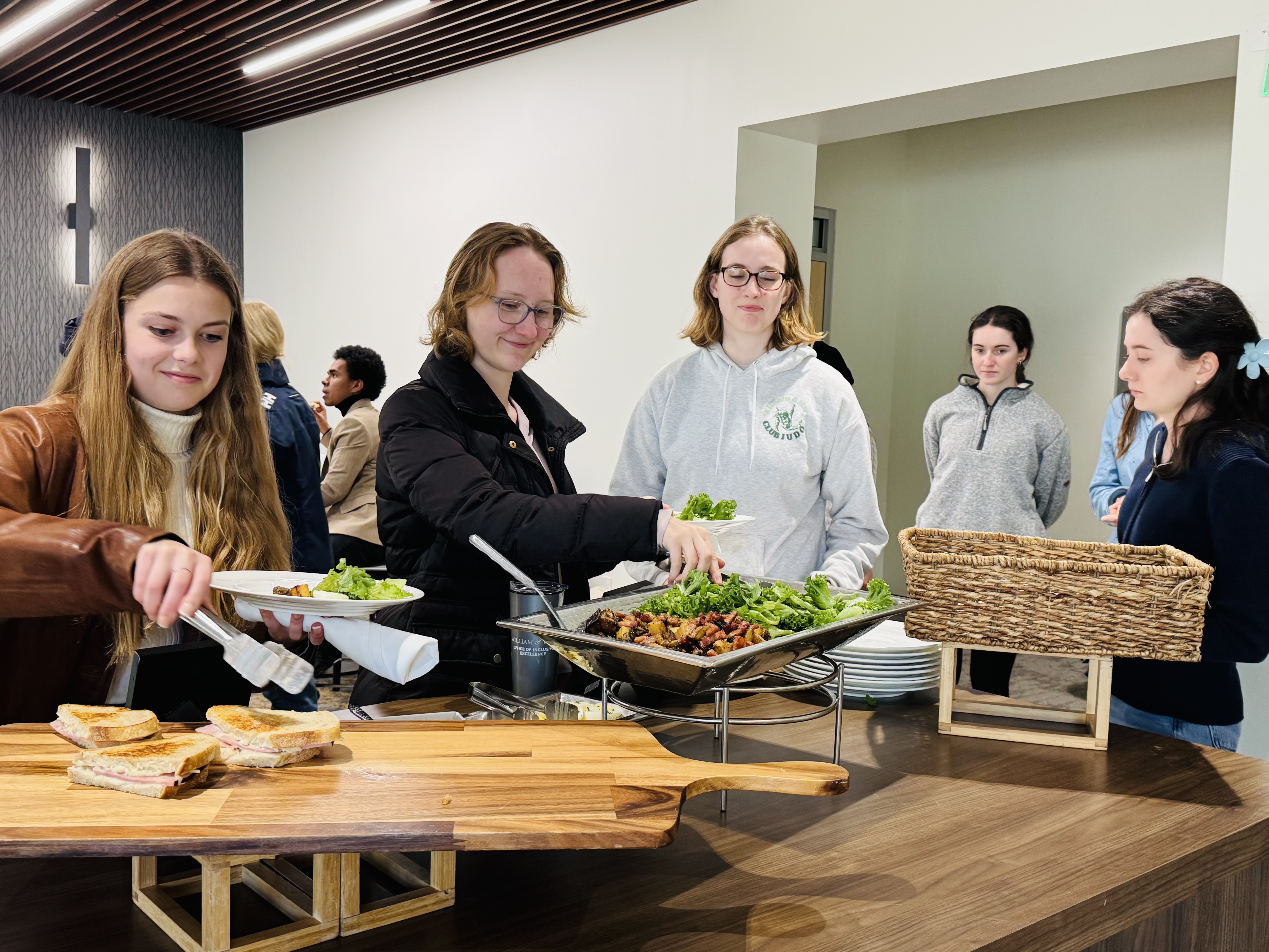 W&M students help themselves to Chiron’s food. Photo by Deborah Lee-Ferrand.