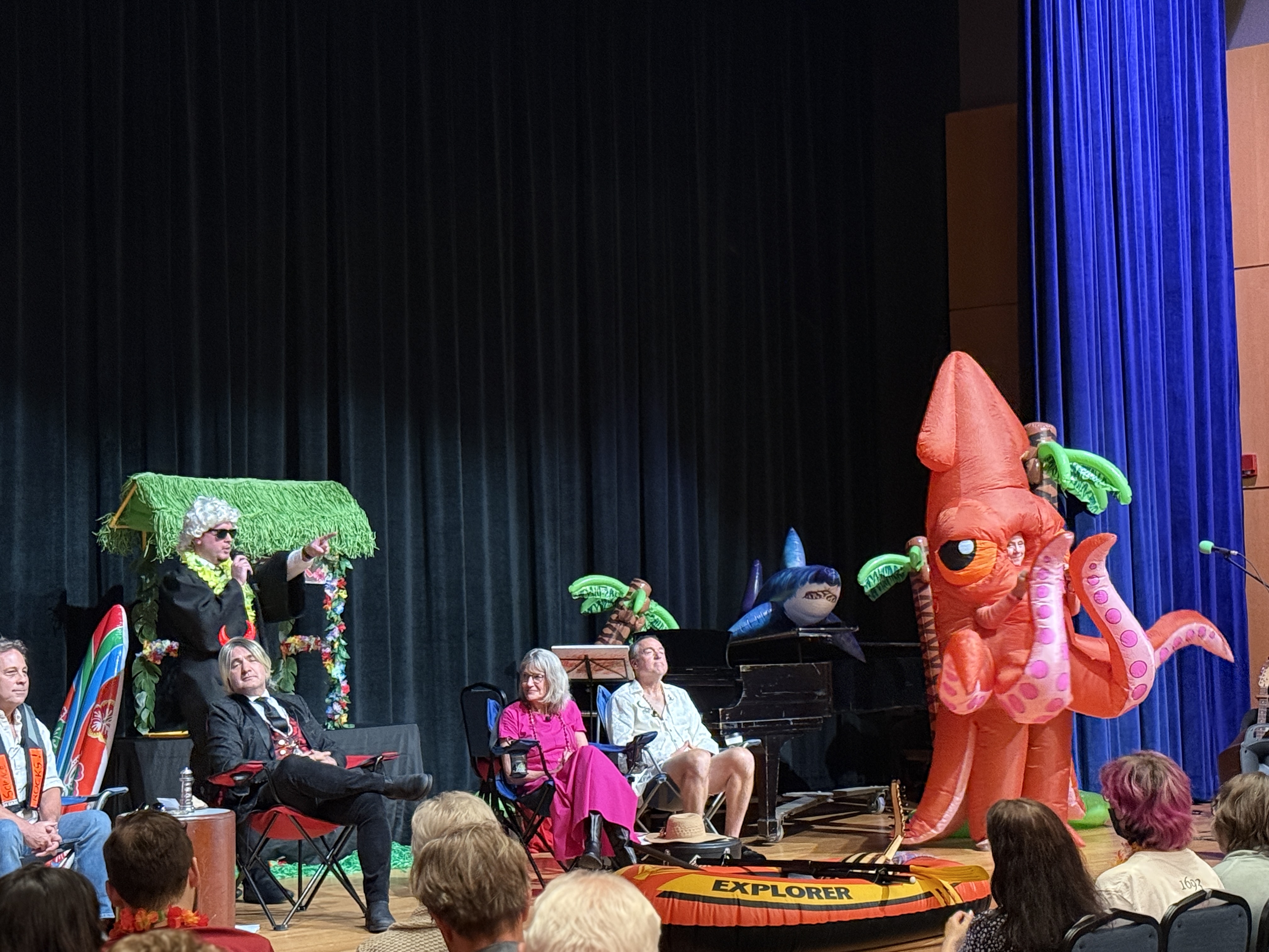 The faculty debaters were joined on stage by judge and emcee Trey Mayo and the fan-favorite squid. 