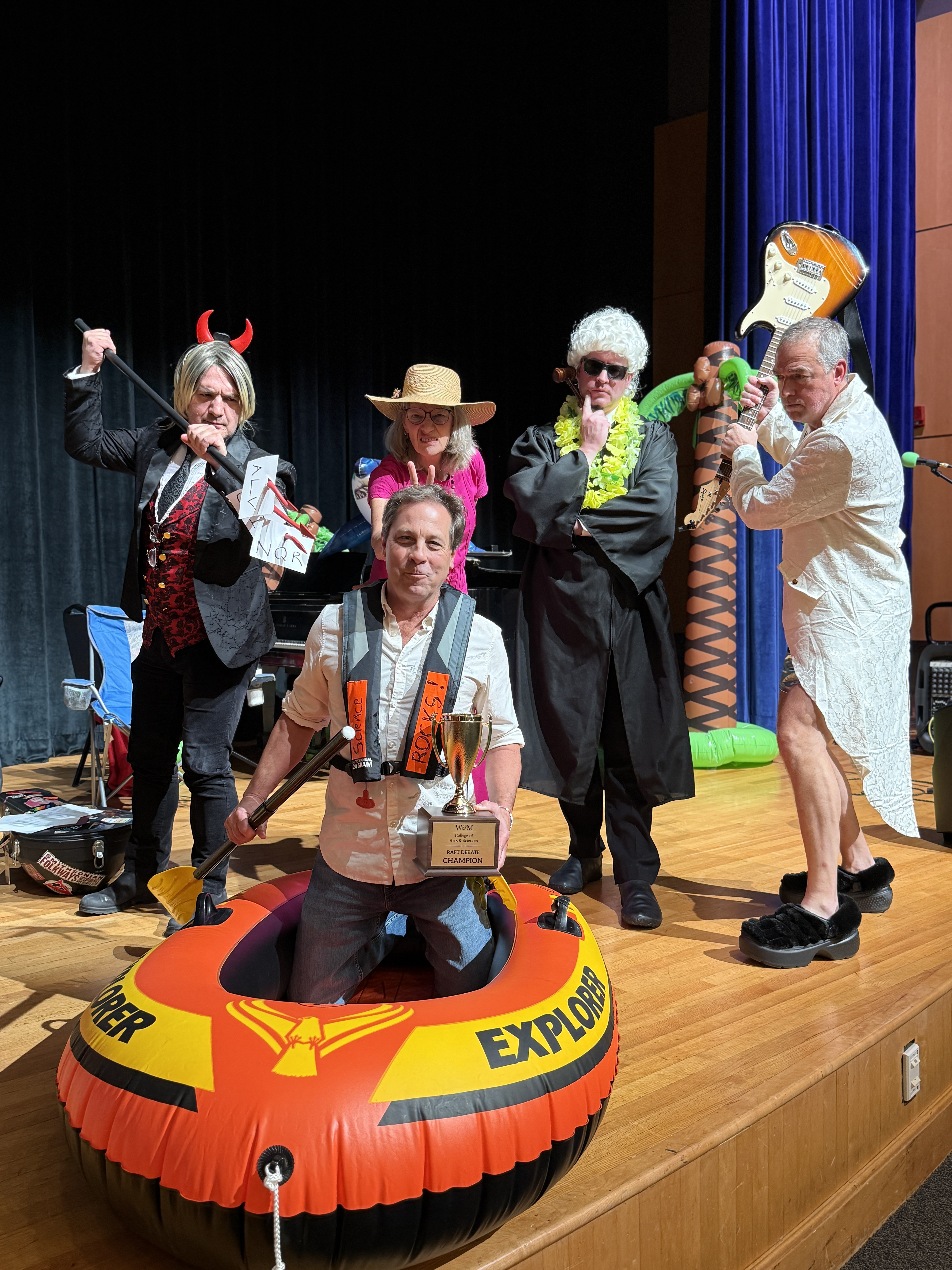 Chuck Bailey (front and center) won the Raft Debate for a second time against opponents Andy Fisher, Anne Rasmussen and Peter Vishton.