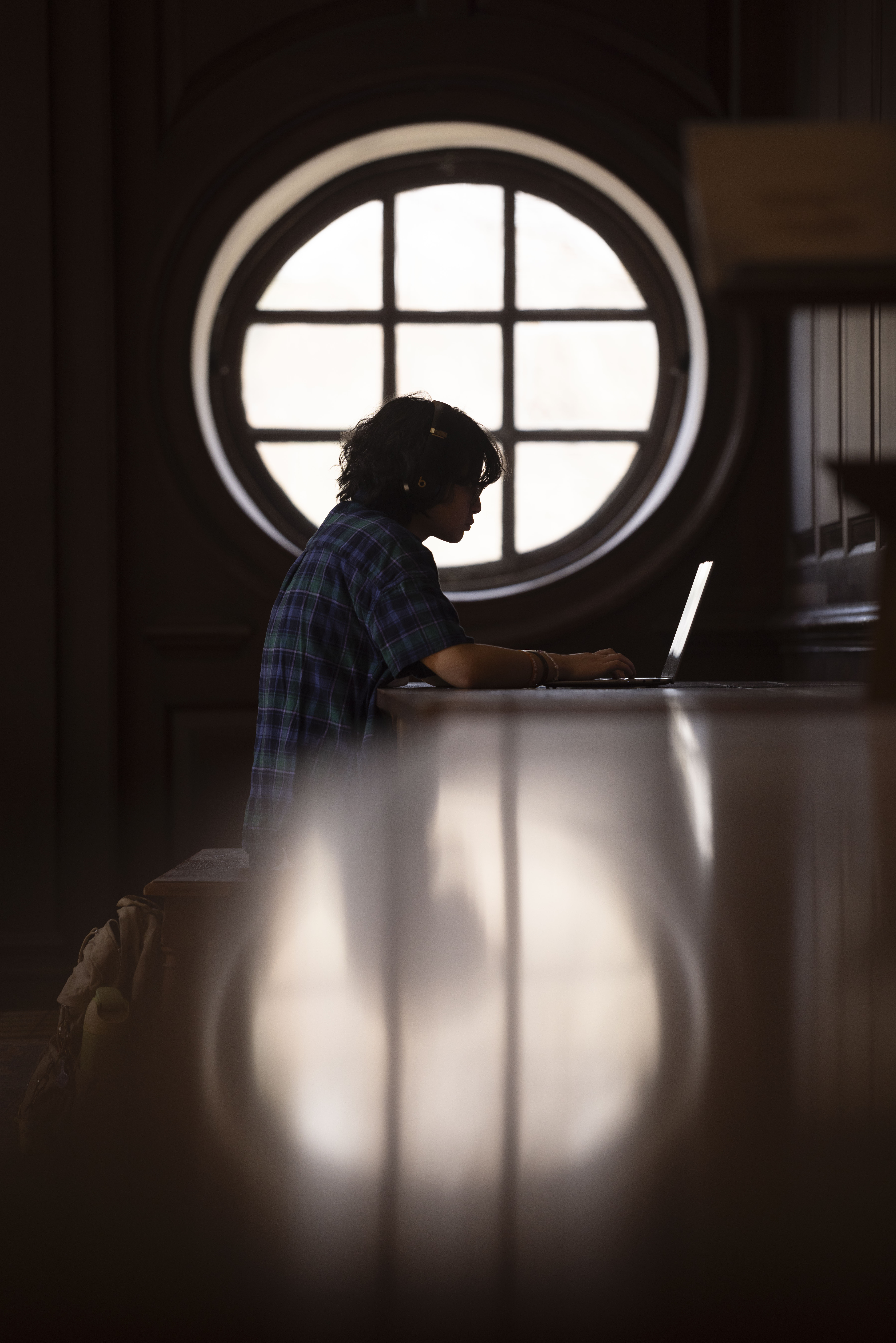 A student studies in the Great Hall inside the Wren Building, home of the religious studies department. Photo by Timothy Sofranko.