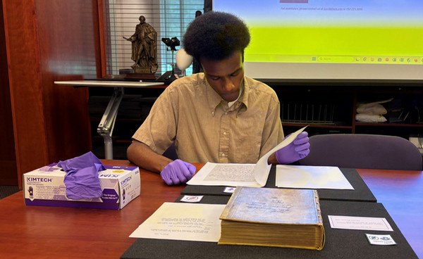 NIAHD Student working in Swem Library Special Collections