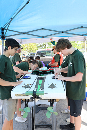 Team members prepare the boat prior to the race
