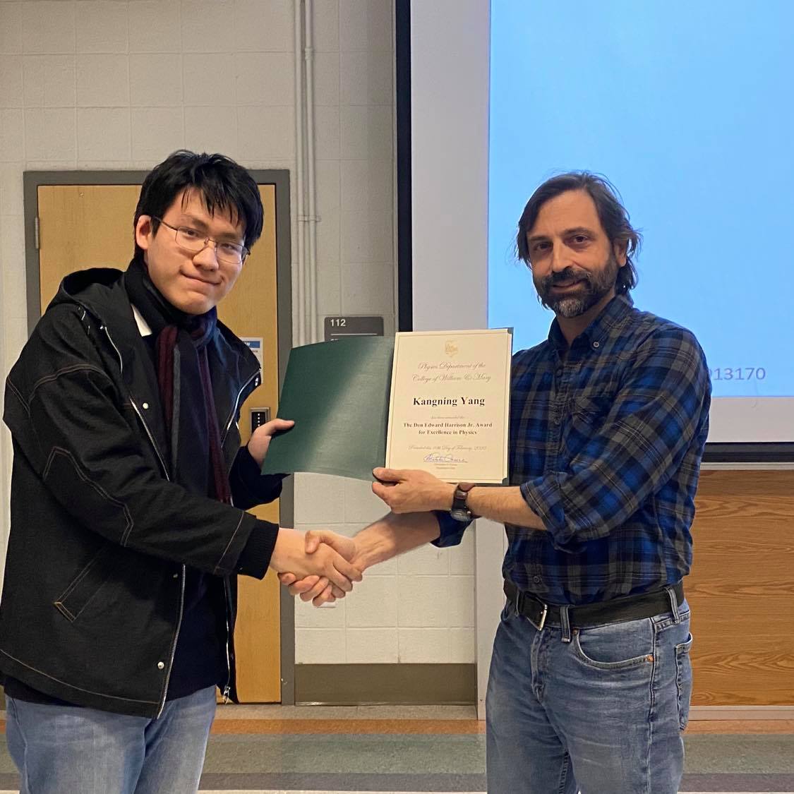 2020 Harrison Award recipient Kangning Yang with Prof. Carone