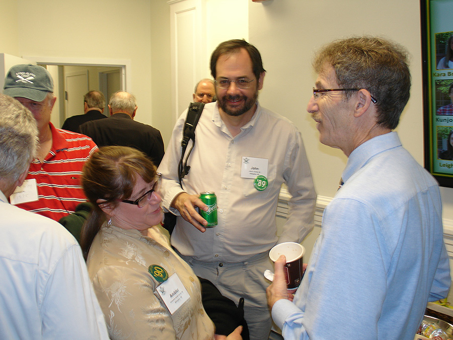 Professor Emeritus Galano catching-up with former students