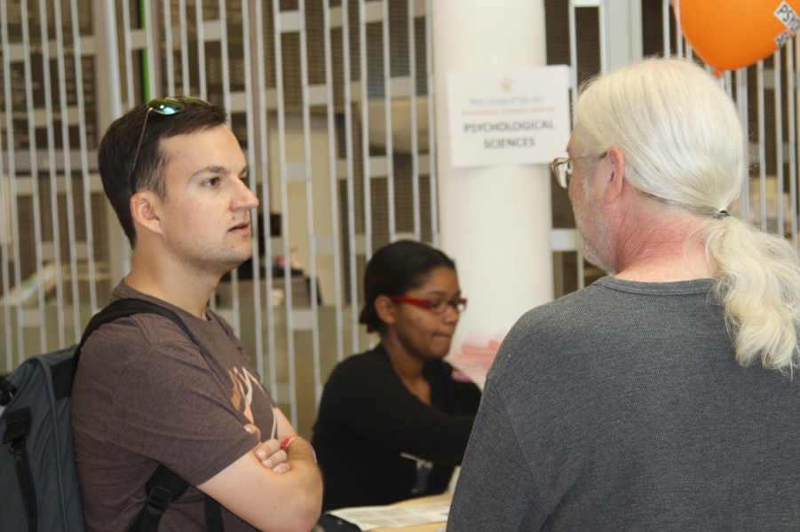 Andy DeSoto (Class of 2009) shares a conversation with Professor Kirkpatrick during registration