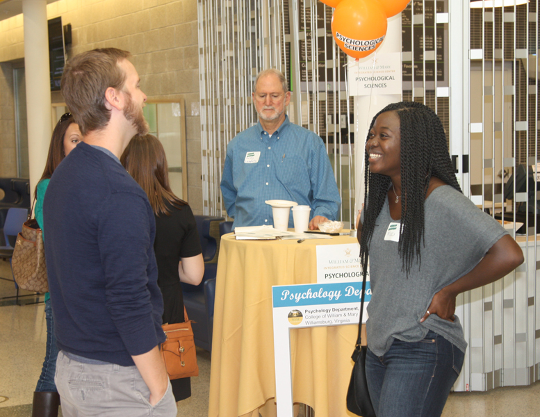 Professor Conway shares a laugh with Maku Orleans-Pobee (Class of 2017) during the Homecoming Open House