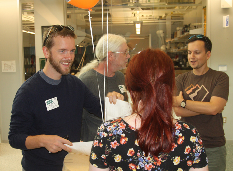 Professor Conway greets Molly Penrod (MA Class of 2018) during registration
