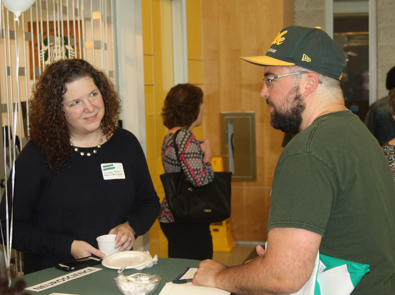 Professor Porter greets a Neuroscience alumnus during registration