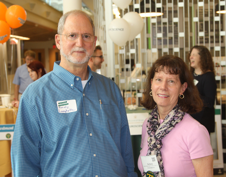 Barabara Keller, Ph.D. and Licensed Clinical Psychologist, poses with Professor Langholtz during the Homecoming Open House.