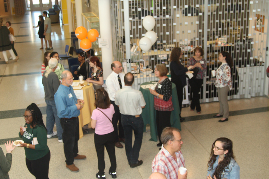Faculty and friends in the atrium during the Homecoming Open House