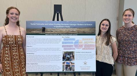 Caroline Clinton, Meredith Endres, and Allie Tobian with their poster