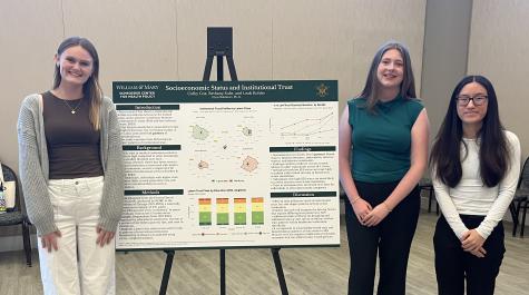 Colby Cox, Bethany Suhr, and Leah Kohler with their poster