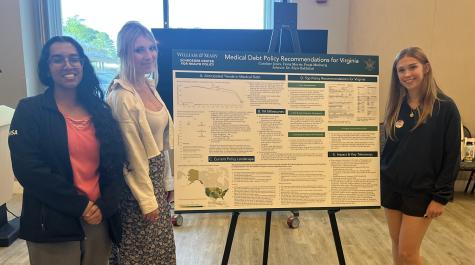 Caroline Jones, Fiona Morris, and Pooja Muthuraj with their poster