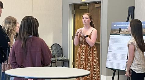 Meredith Endres discussing their poster