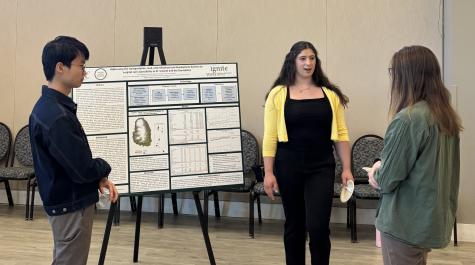 Emily Rosenthal discussing their poster