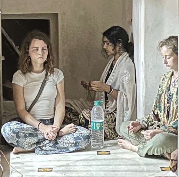 Students meditating at a temple.