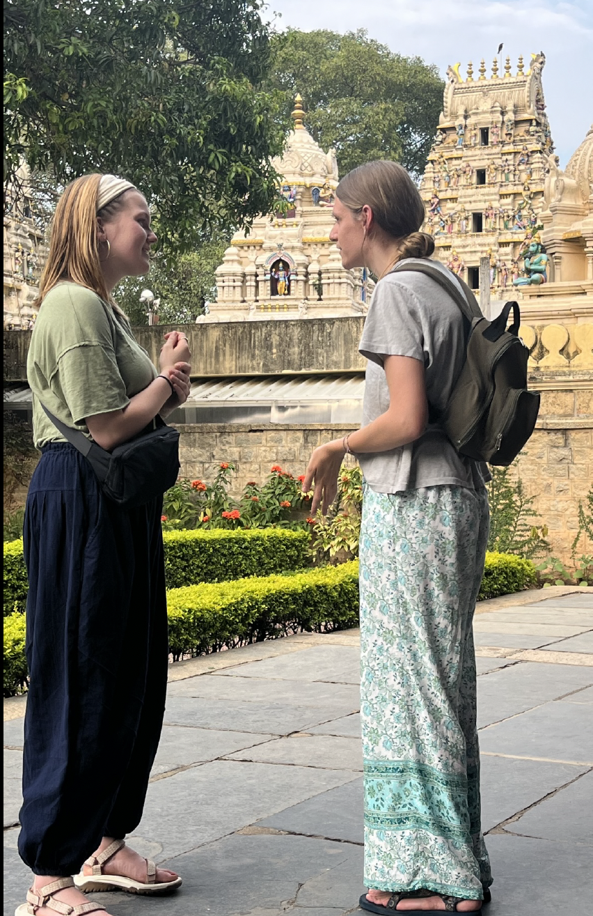 Two students at a temple in India.