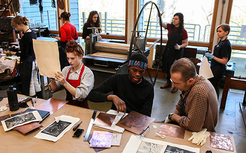 Students working in a print studio