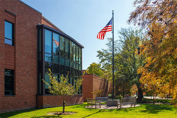 William & Mary Law School with an American flag raised on a flag pole