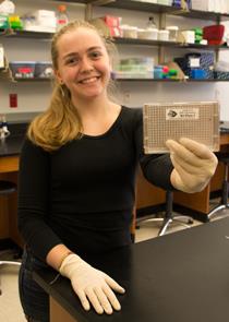 Elli Cryan displays a block of BioBricks. Each iGEM team received an identical set of these biological ''Legos.'' Photo by Joseph McClain