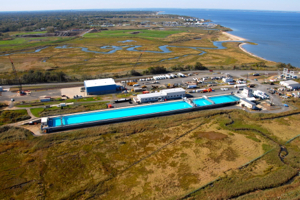 An aerial view of the Ohmsett Wave Tank. Photo courtesy of Ohmsett – The National Oil Spill Response Research & Renewable Energy Test Facility.
