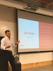 Trevor Jackson '18, president of Agency 1693, gives a presentation at a meeting of the agency's students. (Courtesy photo)