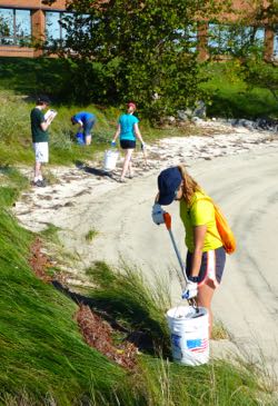 Grad students pick up plastic and other marine litter from VIMS' York River Beach.