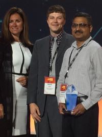 Derek Loftis of VIMS (center) on stage with Sridhar Katragadda (right; systems analyst for the City of Virginia Beach) and Kim Majerus (director of state and local government partnerships at Amazon Web Services) during the ceremony announcing winners of the AWS Best Practices Award for 2017.