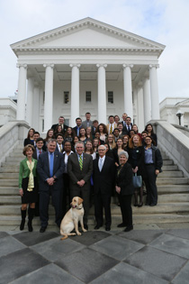 Students pose on the steps of the Capitol Building with Virginia Gov. Terry McAuliffe. (Photo by Stephen Salpukas)