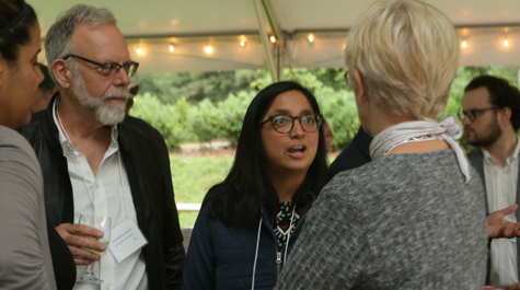 Attendees engage in conversation during the dinner. (Photo by Stephen Salpukas)