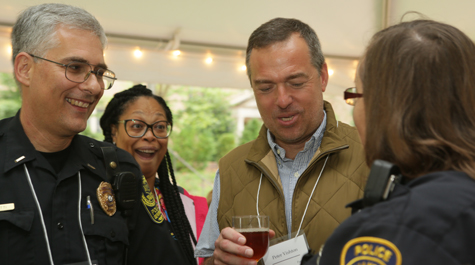 Peter Vishton, associate professor of psychological sciences, talks with representatives from the Williamsburg and W&M police departments. (Photo by Stephen Salpukas)