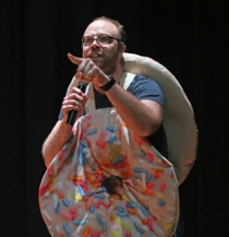 Associate Professor of Chemistry Doug Young, dressed as a donut, threw donuts to the audience.