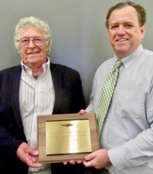 VIMS Emeritus Professor Bill DuPaul (L) receives the 2018 Janice M. Plante Award for Excellence from Dr. John Quinn, Chair of the New England Fishery Management Council. (Photo by J. Plante/NEFMC)