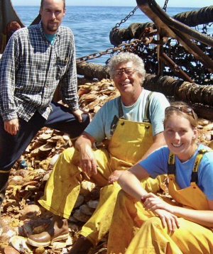 Bill DuPaul (center) with then-students David Rudders (left) and Noëlle Yochum (right) aboard a commercial scallop boat during a 2005 monitoring survey.