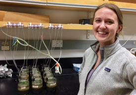 Meredith Evans with the treatments she used to test the effects of various types of plastics on microbial communities in sediments.