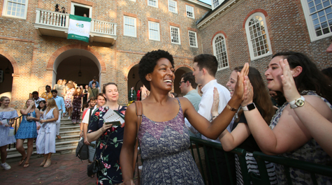 A new student walks through the receiving line after the Opening Convocation ceremony. (Photo by Stephen Salpukas)
