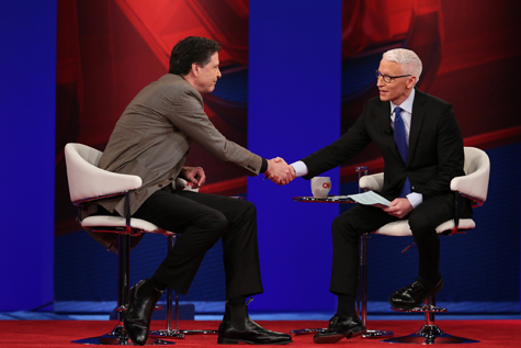 Comey and Cooper shake hands. (Photo by Stephen Salpukas)