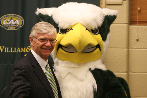 President Taylor Reveley poses with W&M's new mascot, the Griffin, after an unveiling event. (Photo by Stephen Salpukas)