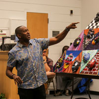 Steve Prince shows a mask project at the Greater Williamsburg Women’s Association Cultural Arts Experience at the Muscarelle Museum of Art in the summer of 2017. (Photo by Skip Rowland '83)