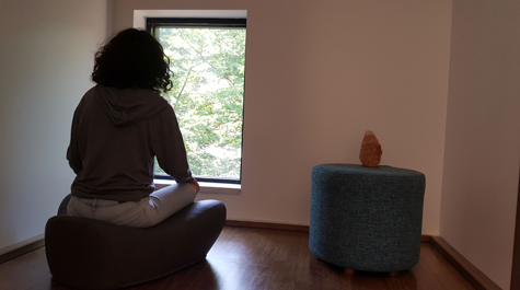 A student uses one of the center's meditation alcoves. (Photo by Jessica Raymond)