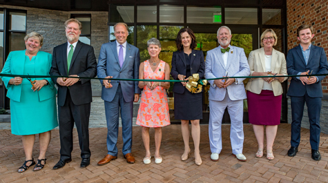 (From left) Director of Campus Recreation Linda Knight, Associate Vice President for Health & Wellness Kelly Crace, Rector John E. Littel, Bee McLeod, President Katherine A. Rowe, J. Goodenow "Goody" Tyler, Vice President for Student Affairs Ginger Ambler and Student Assembly President Brendan Boylan ’19 cut the ribbon on the center Aug. 28. (Photo by Skip Rowland '83)
