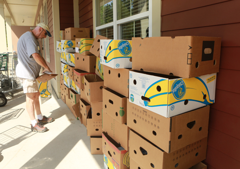Boxes of bananas are stacked outside of the center. (Photo by Stephen Salpukas)