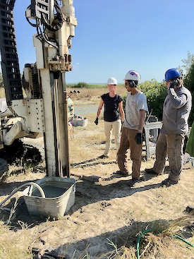 Chris Hein (center) prepares to collect a sediment core from a barrier island with VIMS colleagues Jennifer Connell (left) and Justin Shawler. (VIMS photo)