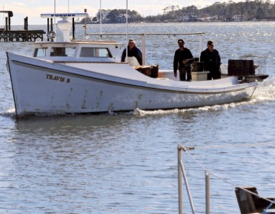 A crab boat pulls into the dock along Gwynn's Island. (Photo by A. Devlin/VASG)