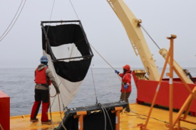 Steinberg (right) and Marine Technician Josh Mitchell retrieve a plankton net from the icy waters of the Southern Ocean along the Antarctic Peninsula. (Photo by P. Thibodeau/VIMS)