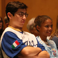 Two soccer fans listen to the discussion. (Photo by Stephen Salpuka)