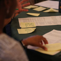 Small groups held discussions and reported their feedback, which was collected on paper, to the larger group. (Photo by Stephen Salpukas)