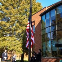 Members of the W&M Police Department raise the flag for the first time. (Photo by David F. Morrill)